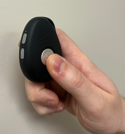 Press-and-hold the large central button of the GPS Pendant to activate it
